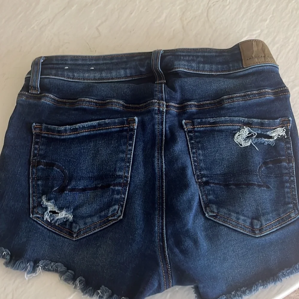 dark blue jean shorts with rips in perfect condition - Picture 2 of 2